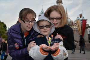 Disney PhotoPass photographers put Tink in my son's hands.